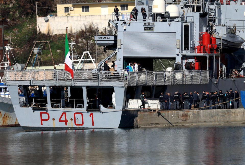 Migrants disembarking from an Italian ship in Albania.