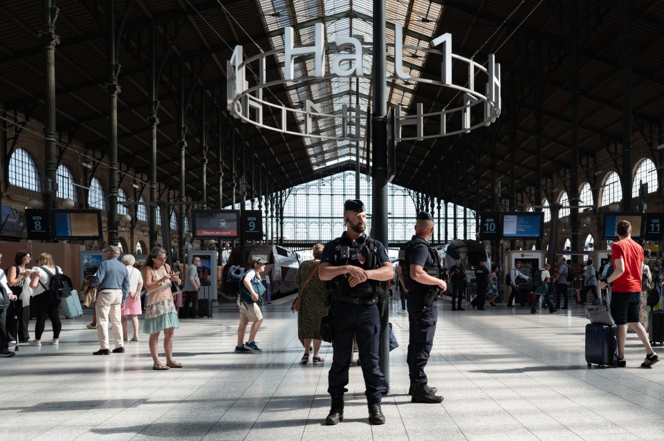 Police officers at Gare du Nord station in Paris during immigration checks.
