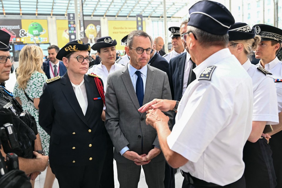 French Interior Minister Bruno Retailleau speaks with French border police at Gare du Nord station.