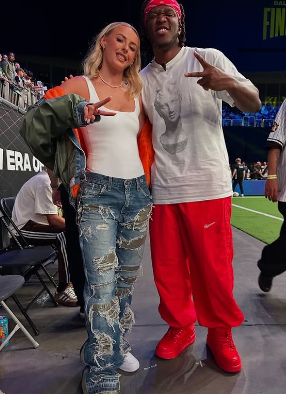 Photo of KSI and a blonde woman posing together.