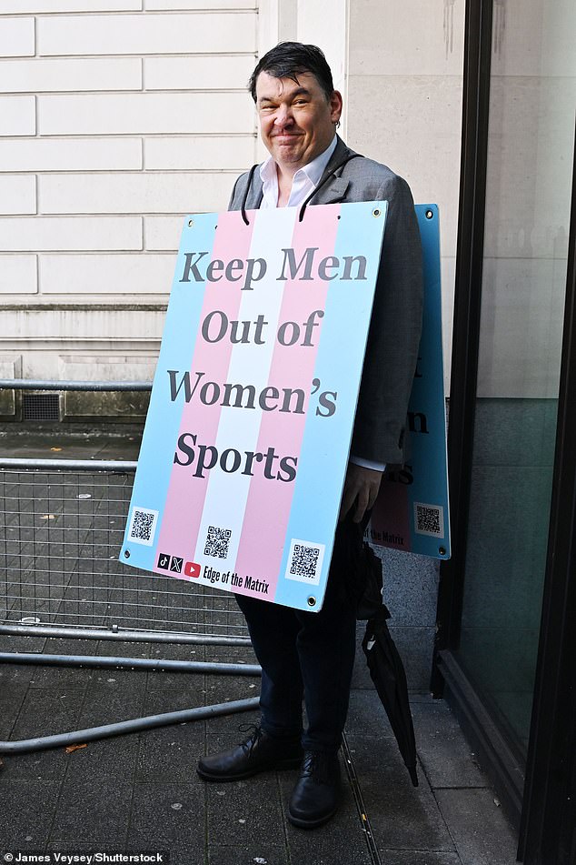 Linehan wore a placard outside the court doors this morning which read 'Keep men out of women's sports'