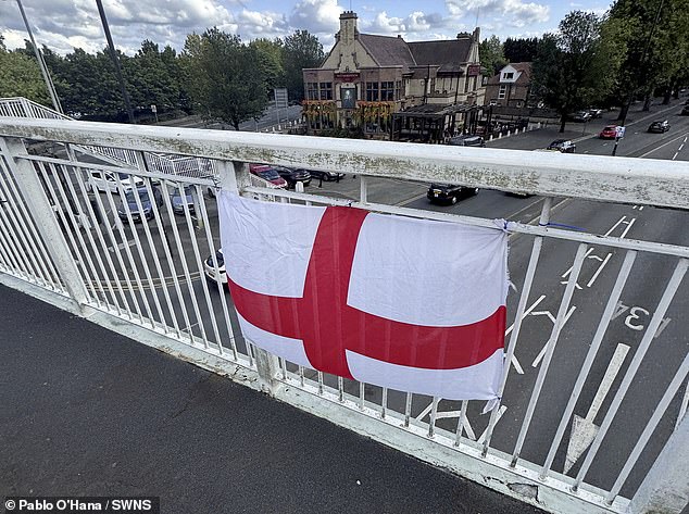 An online campaign called Operation Raise the Colours has encouraged Brits to put up St George's flags and Union Jacks across the country. Pictured: A flag in Manchester