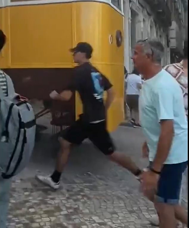 Dramatic video shows bystanders sprinting toward the wreckage, hoping to pull survivors from the debris