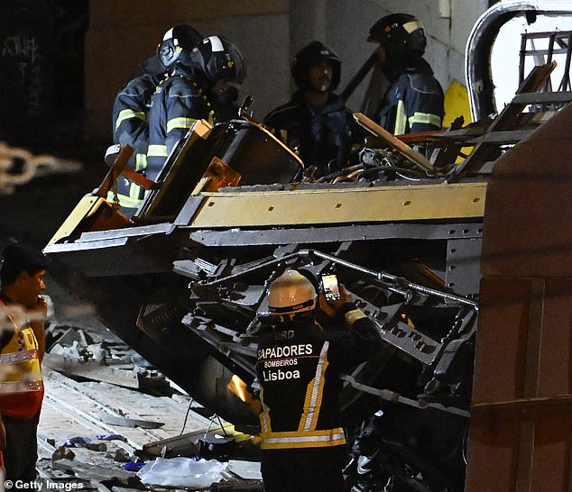 Firefighters work the scene at Gloria funicular derail site