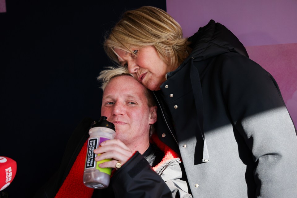 Jamie Laing and his mother embrace during a Red Nose Day event.