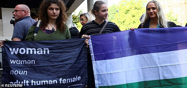 Activists demonstrate on the day Irish comedy writer Graham Linehan, who has been charged with harassment and criminal damage involving a transgender activist, appears at Westminster Magistrates' Court, in London, Britain, September 4, 2025. REUTERS/Jack Taylor