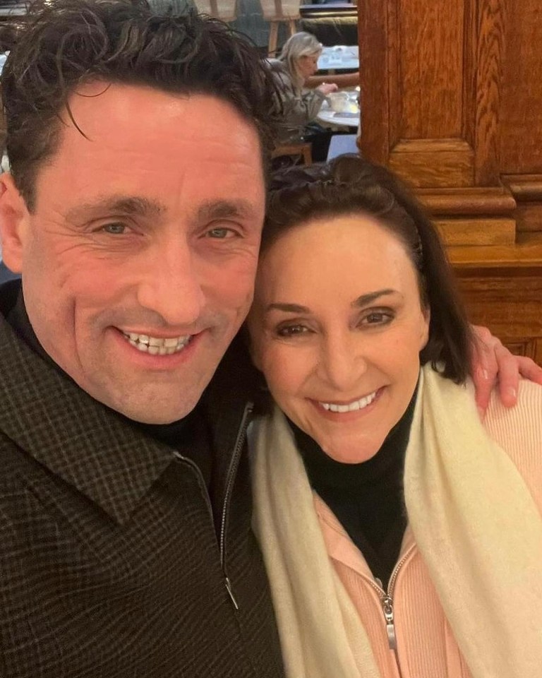 Photo of Shirley Ballas and a man smiling for the camera.