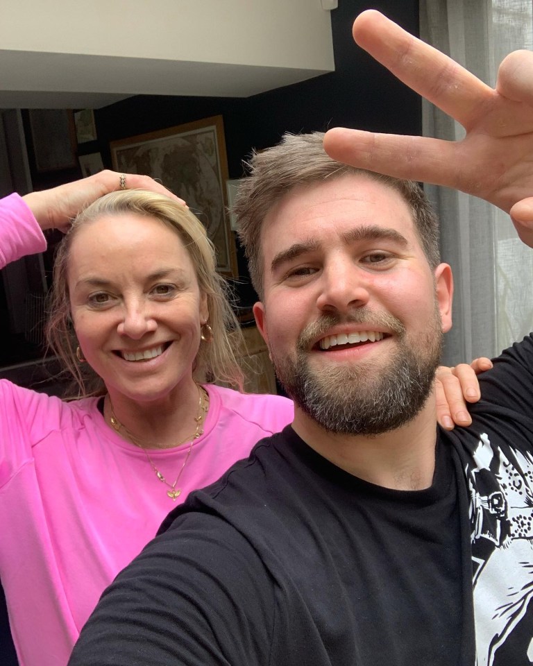 Tamzin Outhwaite and Tom Child embracing.