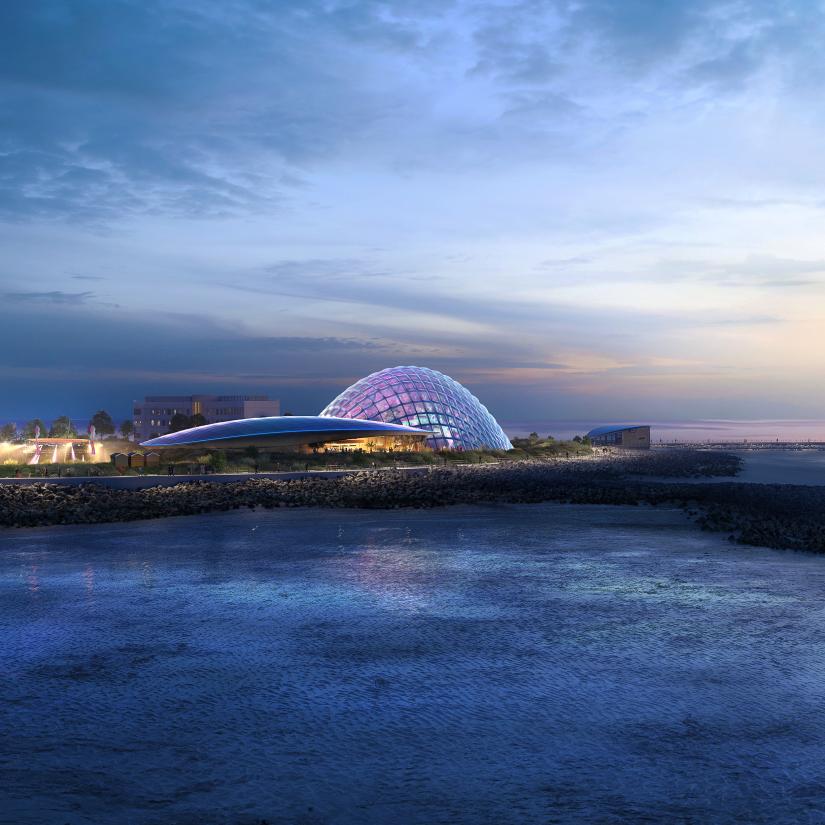 Rendering of a coastal building complex with a large geodesic dome.