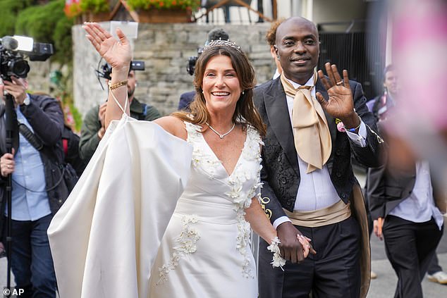 Waving to the press and people who came to line the streets to see them as they wed
