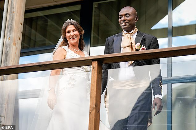 Princess Martha and husband Durek greeted people from a balcony
