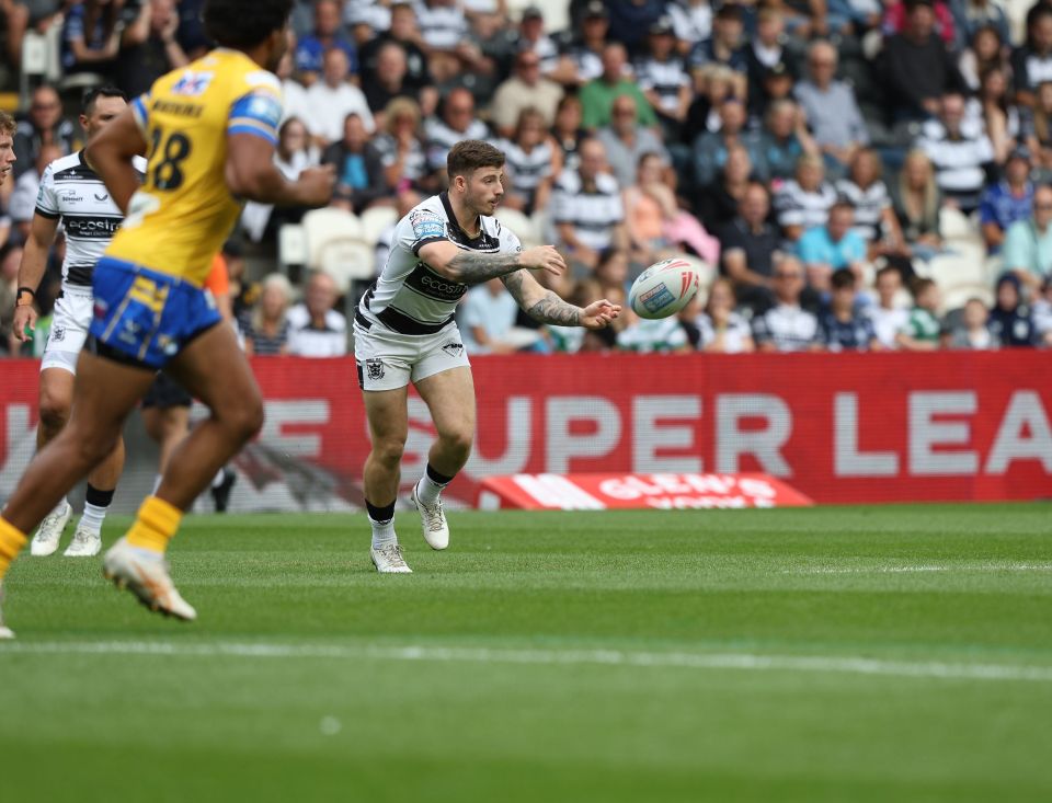 Rugby player throwing the ball during a match.