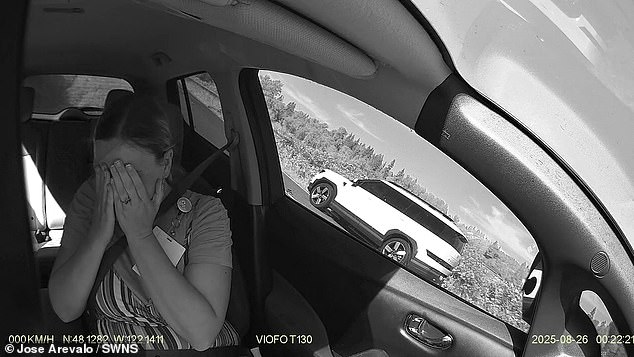 The woman was then seen screaming and covering her face following the crash