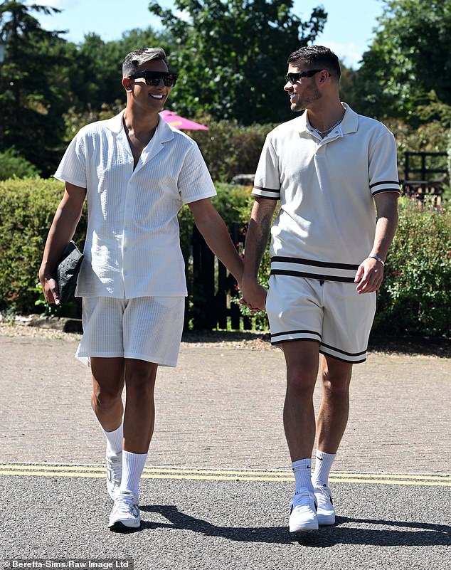 Junaid Ahmed and boyfriend Joe Blackman looked as smitten as ever as they held hands on their way to the pub