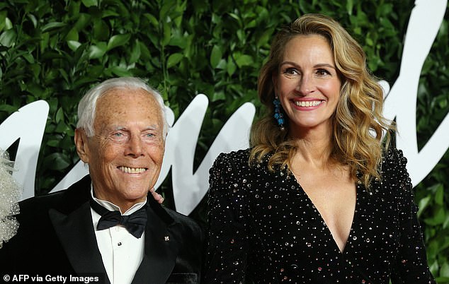 Armani and US actress Julia Roberts pose on the red carpet at The Fashion Awards 2019 in London on December 2, 2019