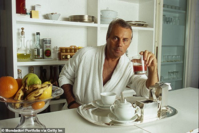 Armani pictured here in his kitchen in 1984 while enjoying breakfast