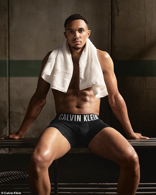 Nice and dry: Alexander-Arnold soaks up the water with a towel as he poses on a bench