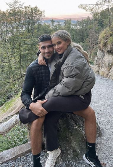 Molly Mae Hague and Tommy Fury sitting together in Switzerland.