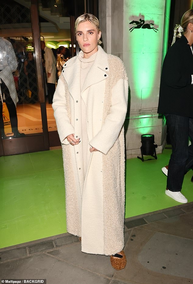 Tigerlily Taylor, 30, kept warm in an oversized knitted coat