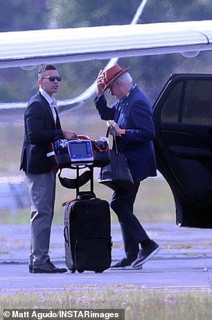 Bill and Hill were spotted boarding a private plane in the Hamptons ahead of Labor Day weekend... with a defibrillator!