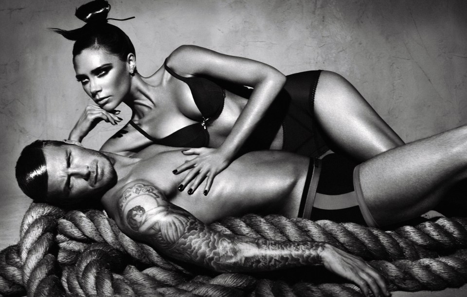 Black and white photo of David and Victoria Beckham in Emporio Armani underwear.