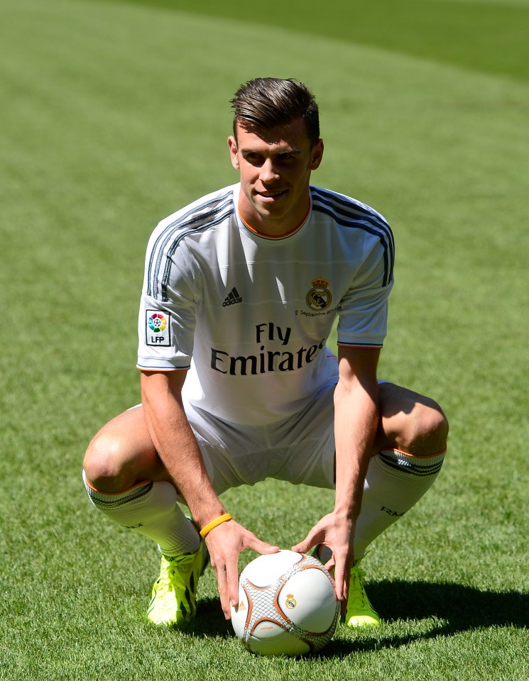 Gareth Bale, Real Madrid player, crouching with soccer ball.