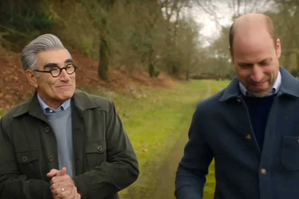 Eugene Levy and Prince William walking together.