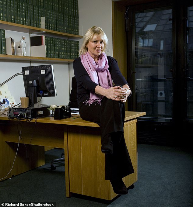 'I soon learnt that if you were a Conservative MP on the right of the party, it was a very lonely place.' Nadine is pictured in her office at Portcullis House in 2011