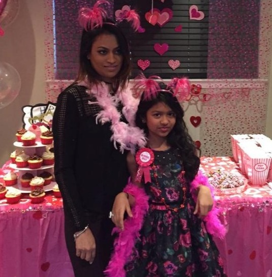 Photo of a mother and daughter at a birthday party.