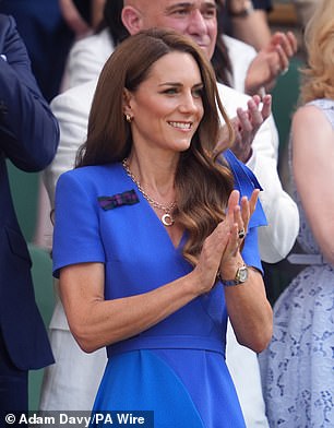 Kate's usual brunette locks are a few shades darker. Pictured at Wimbledon in July