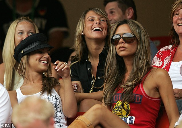 Coleen (centre) pictured with Victoria, (right) in the stands ahead of the FIFA World Cup match between England and Trinidad and Tobago in Baden-baden, Germany, in 2006