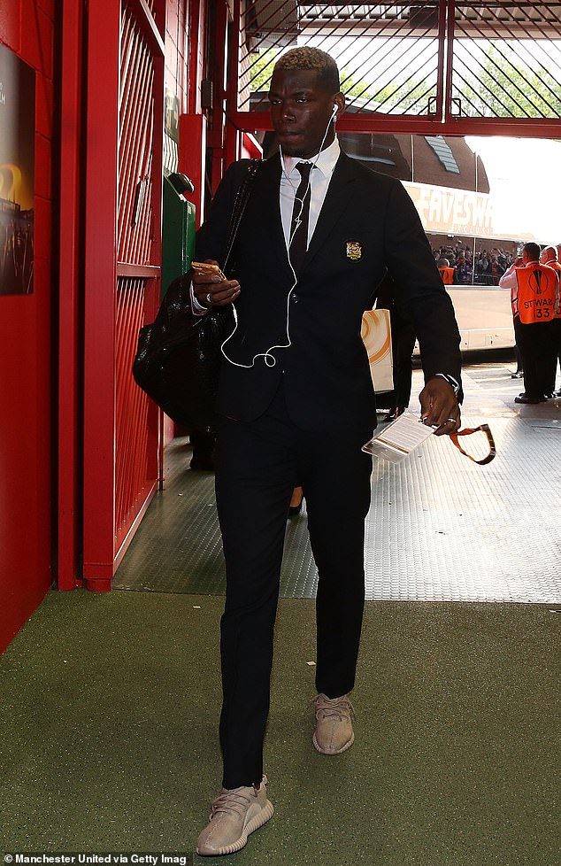 Rooney's team-mates, such as Paul Pogba (pictured), used to wear trainers with their suits