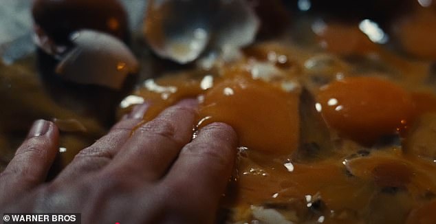 Elsewhere, a finger renders an egg inedible when it crushes its yolk along with several other scattered eggs