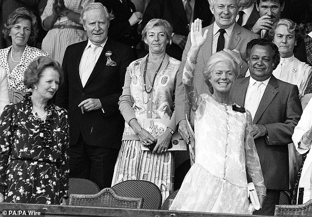 The Duchess of Kent acknowledges the crowd from the Royal box at Wimbledon in July 1975 as Margaret Thatcher smiles and looks on