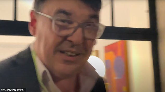A screengrab from a video in which Linehan is alleged to have thrown Ms Brooks's mobile phone. He claimed to police she had taunted him about his divorce