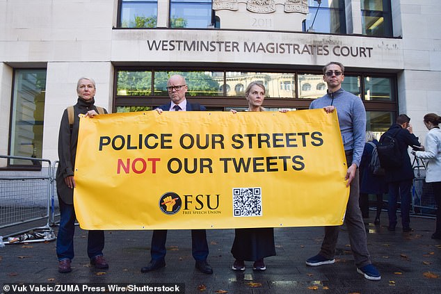 He was supported by other gender-critical activists and the Free Speech Union, led by Lord Young (second from left)