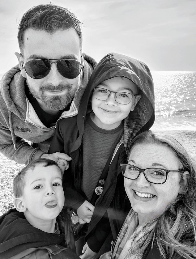 Carter, pictured with his older brother and parents, caught chickenpox shortly after his older brother - despite Elise trying to keep them separate