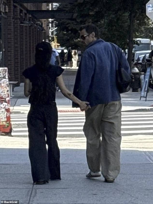 Harry Styles and Zoe Kravitz were spotted holding hands while out in Brooklyn, New York, on Wednesday, amid claims they are just 'friends with benefits.'