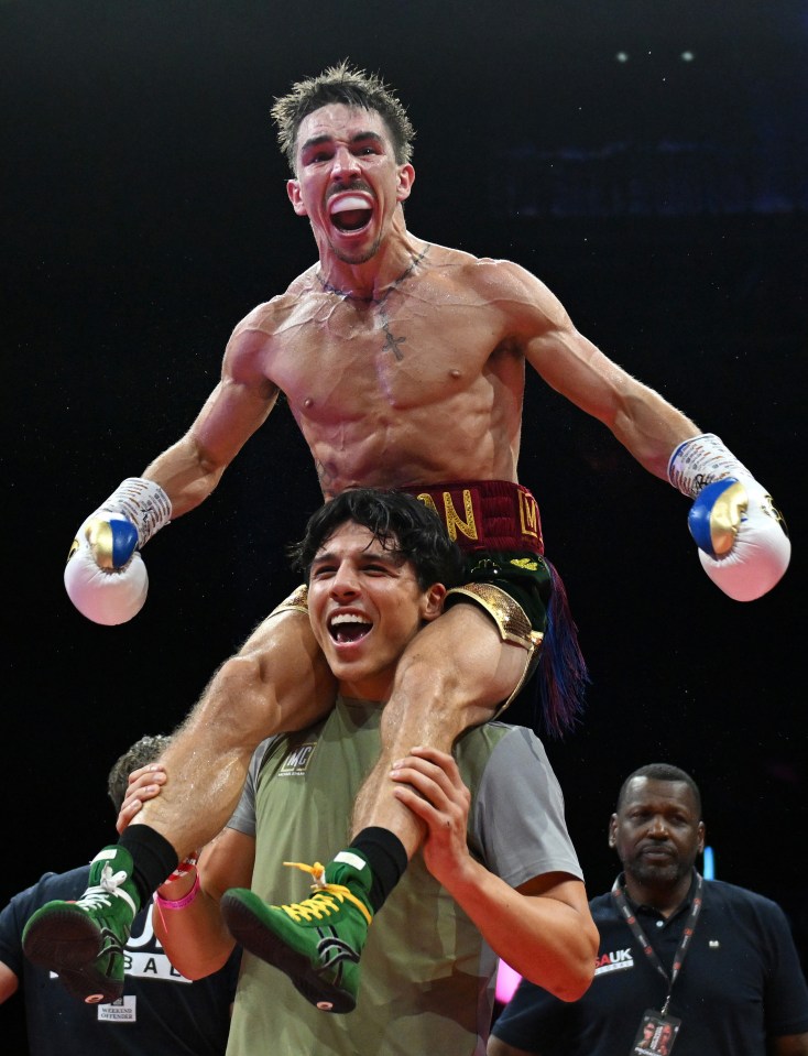 Michael Conlan celebrating a victory, carried on someone's shoulders.