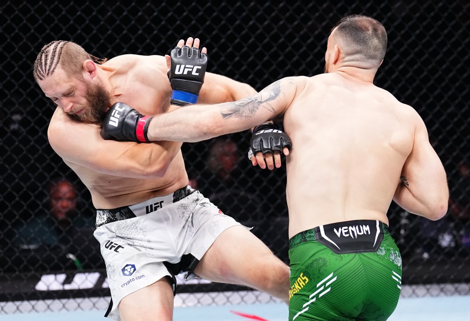 Modestas Bukauskas punches Marcin Prachnio in a UFC fight.