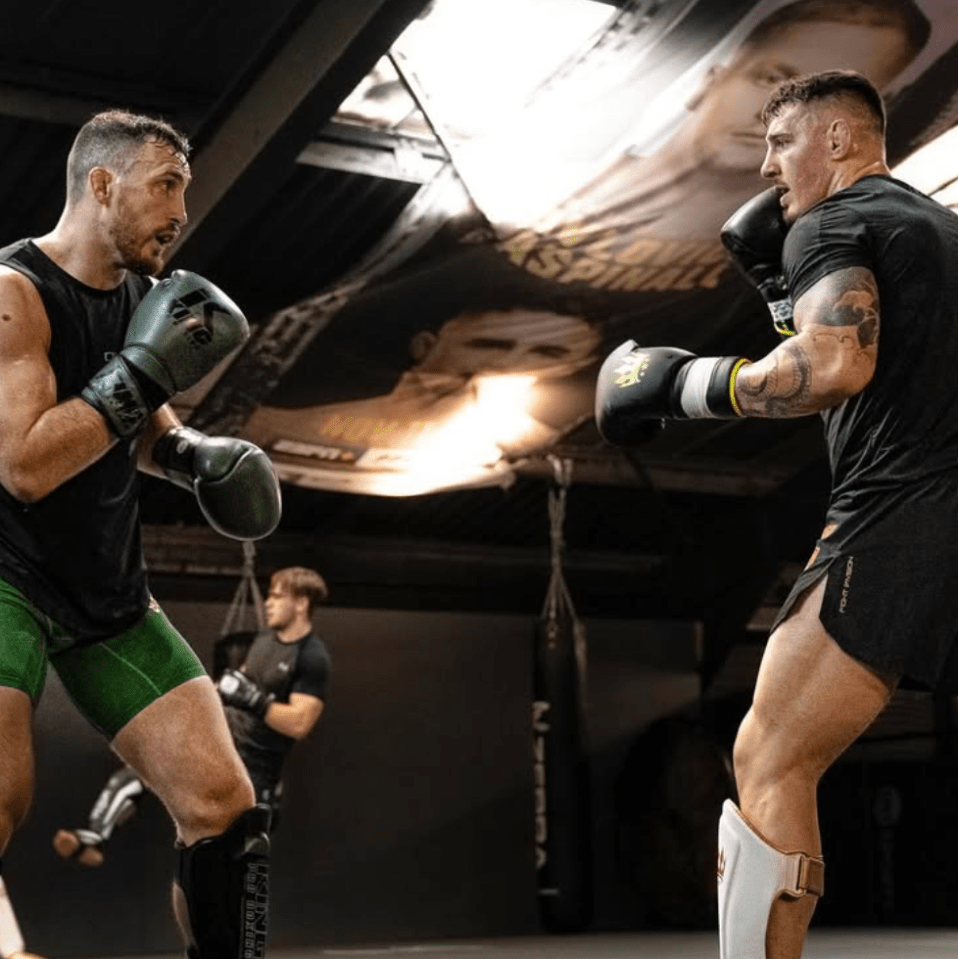 Two men boxing in a gym.