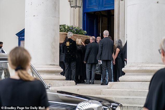 Friends and family gathered as her coffin went into church