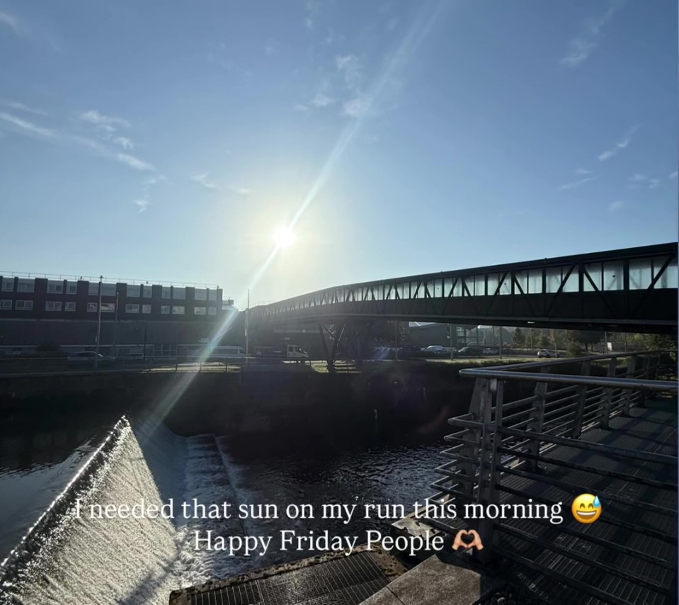 Sunny morning view of a footbridge over a waterway.