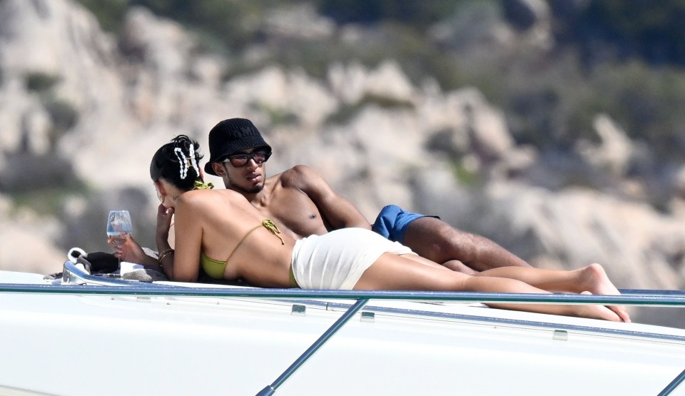 Jude Bellingham and Ashlyn Castro relaxing on a yacht.