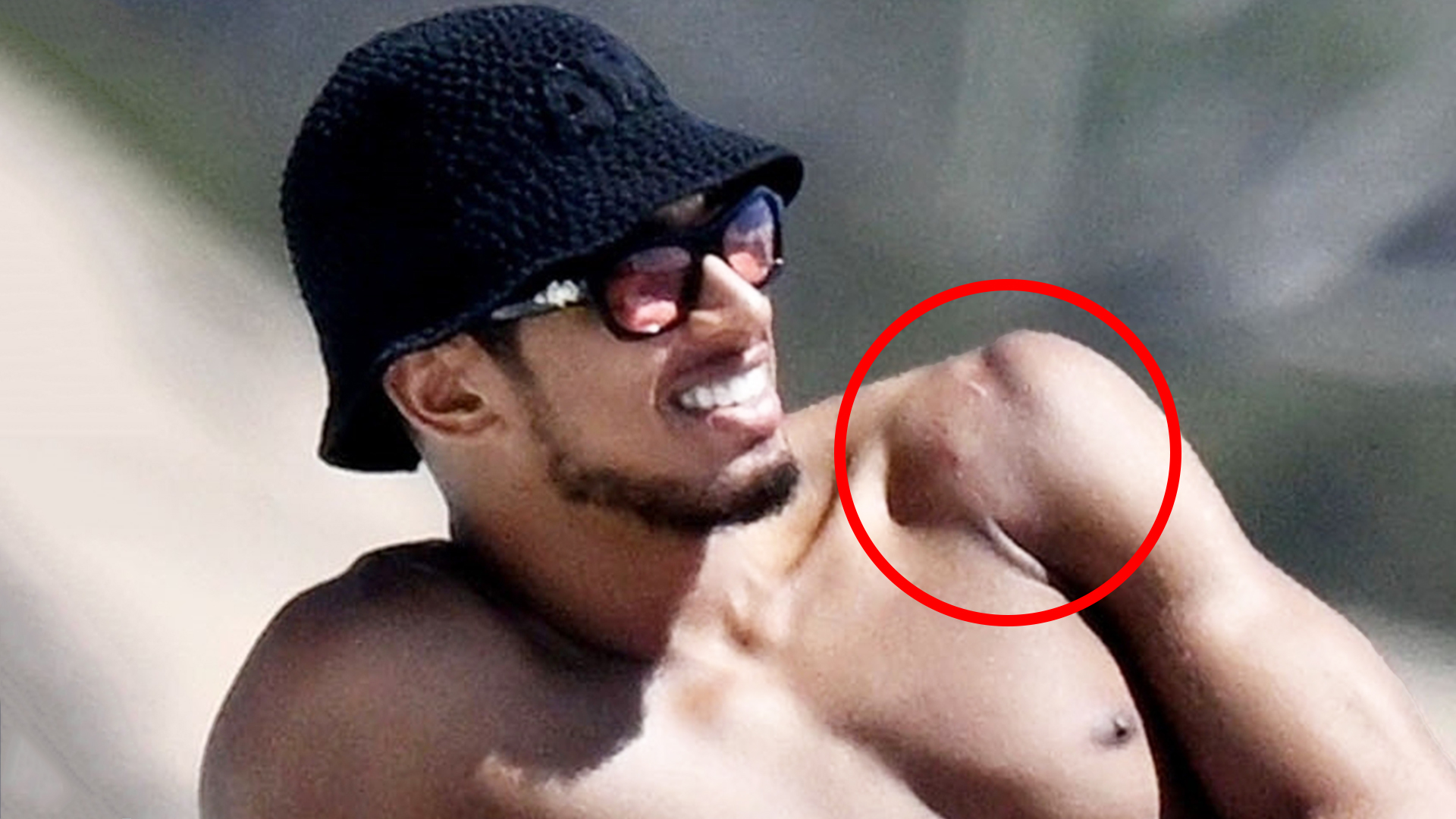 Topless Jude Bellingham shows off shoulder scar after surgery as Real Madrid star relaxes with girlfriend on boat