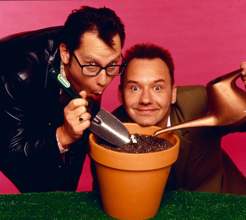 Vic Reeves and Bob Mortimer planting a flower.