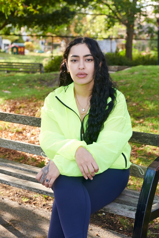 Woman sitting on a park bench.