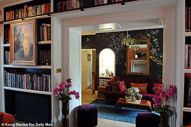 Through his living room and library is a seating area that leads through to the dining room