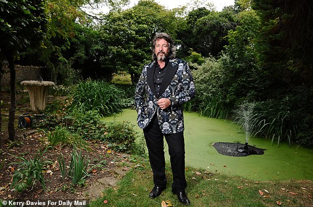 Laurence's garden also features a large pond, with an outdoor swimming pool behind