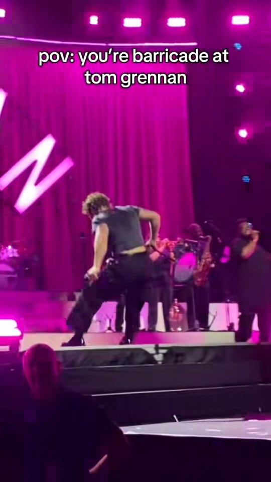 Tom Grennan falling on stage.